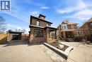 View of front of house featuring an outbuilding, brick siding, asphalt driveway, and a garage - 273 Stinson Crescent, Hamilton, ON 