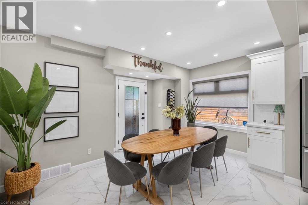 Bright dining area featuring recessed lighting and large format tile flooring - 273 Stinson Crescent, Hamilton, ON