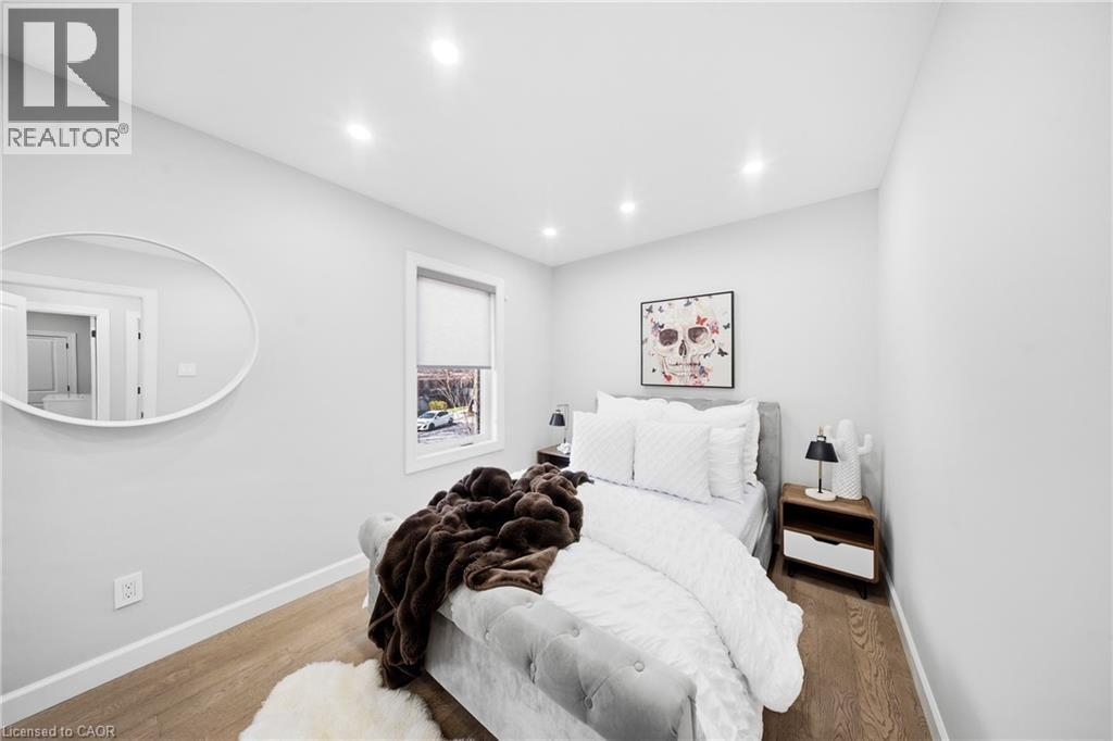 Bedroom with wood finished floors and recessed lighting - 273 Stinson Crescent, Hamilton, ON