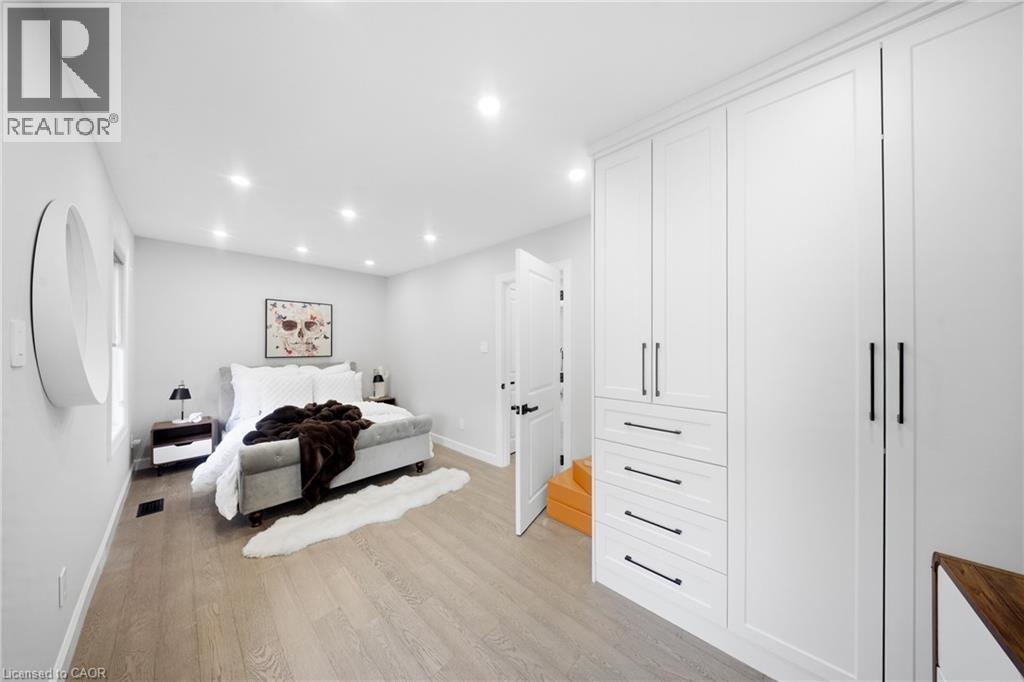 Bedroom featuring light wood-style floors and recessed lighting - 273 Stinson Crescent, Hamilton, ON