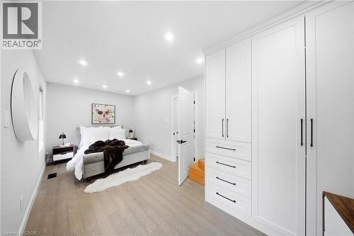 Bedroom featuring light wood-style floors and recessed lighting - 273 Stinson Crescent, Hamilton, ON 
