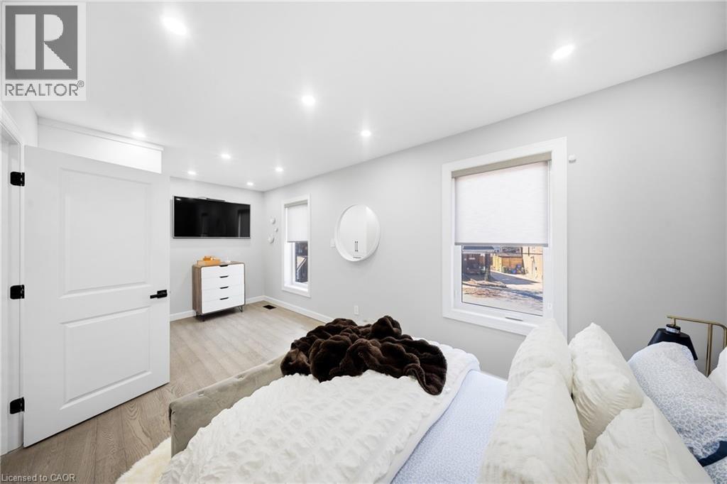 Bedroom featuring light wood finished floors and recessed lighting - 273 Stinson Crescent, Hamilton, ON