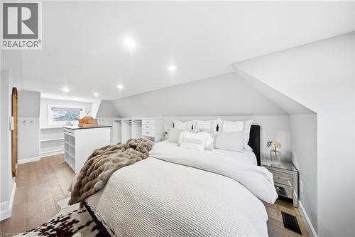 Bedroom with light wood-type flooring, recessed lighting, and lofted ceiling - 273 Stinson Crescent, Hamilton, ON 