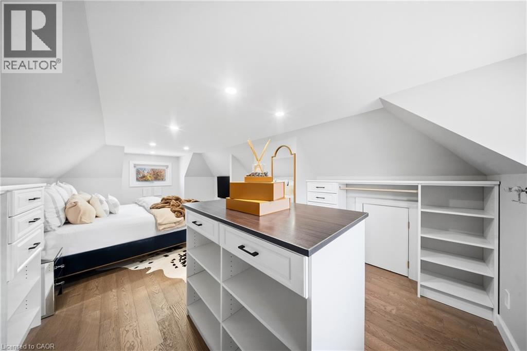 Walk in closet featuring lofted ceiling and dark wood-style floors - 273 Stinson Crescent, Hamilton, ON