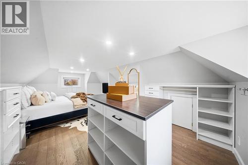Walk in closet featuring lofted ceiling and dark wood-style floors - 273 Stinson Crescent, Hamilton, ON 