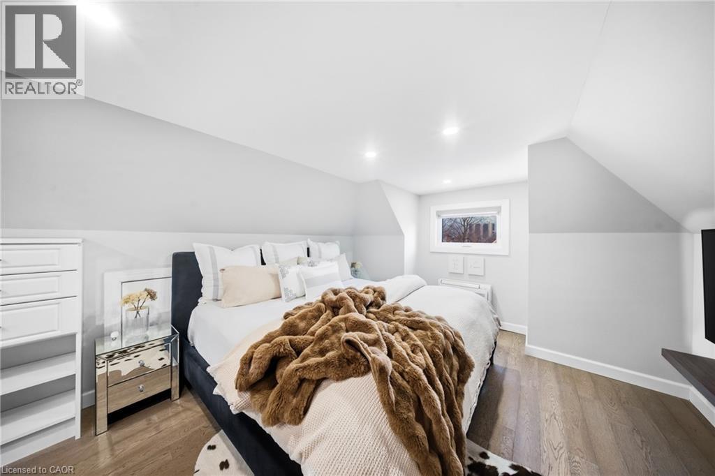 Bedroom featuring dark wood-type flooring and lofted ceiling - 273 Stinson Crescent, Hamilton, ON