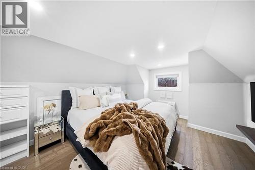 Bedroom featuring dark wood-type flooring and lofted ceiling - 273 Stinson Crescent, Hamilton, ON 