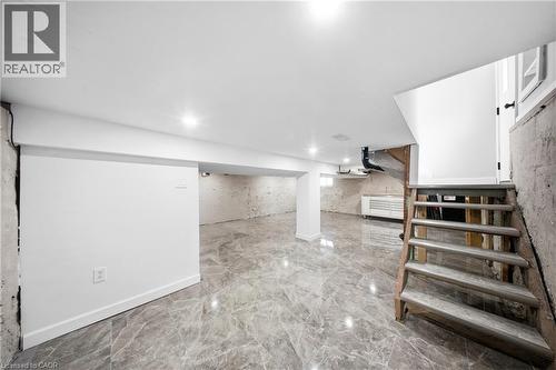 Finished basement featuring stairs and light marble finish flooring - 273 Stinson Crescent, Hamilton, ON 