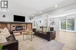 Brick fireplace with a substantial wood mantel -