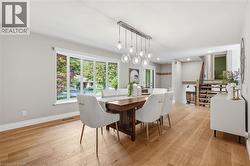Wide plank wood-finish flooring throughout -