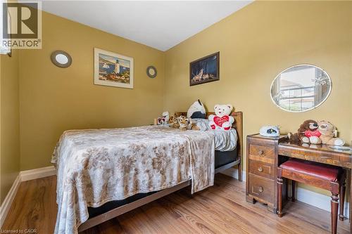 Wood-finish flooring with white trim - 625 Tate Avenue, Hamilton, ON 