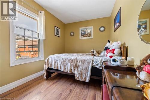 Wood-finish flooring with crisp white trim - 625 Tate Avenue, Hamilton, ON 