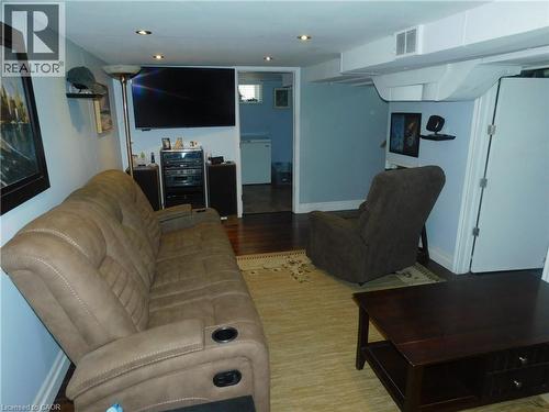 Recessed ceiling lighting, wood-finish flooring, light blue wall paint, and white trim - 625 Tate Avenue, Hamilton, ON 