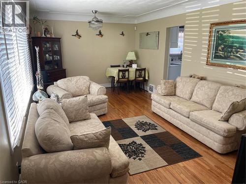 Living area with baseboards, plenty of natural light, and wood finished floors - 625 Tate Avenue, Hamilton, ON 