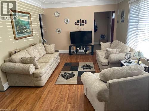 Living area with baseboards and wood finished floors - 625 Tate Avenue, Hamilton, ON 