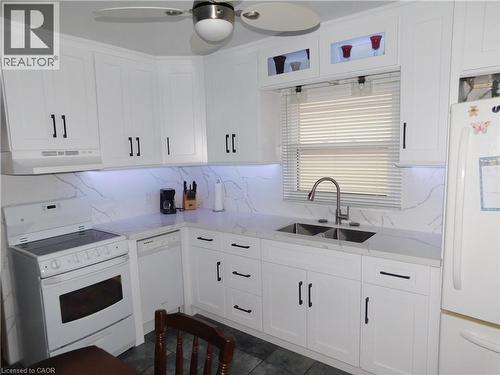 White cabinetry with matte black hardware - 625 Tate Avenue, Hamilton, ON 