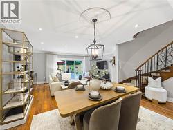 Hardwood-finish flooring, recessed lighting, and a decorative ceiling medallion - 