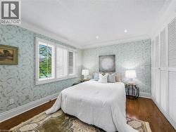 Hardwood flooring, crown molding, recessed lighting, plantation shutters, and built-in louvered closet doors - 