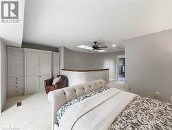 Built-in cabinetry, arched wall, skylight, ceiling fan, recessed lighting - 