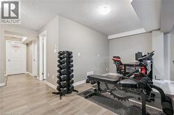 Recessed ceiling with white trim, light gray walls, and light-toned tile flooring - 