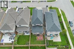 Gabled rooflines, rear deck, and fenced backyard - 