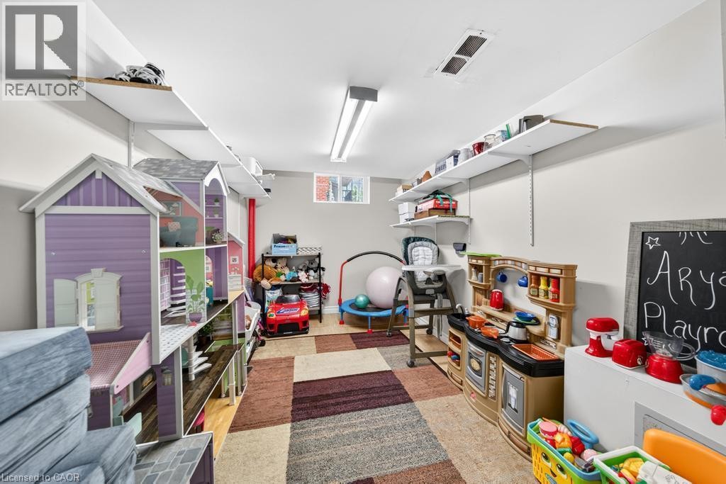 Recessed window, white walls, built-in shelving, overhead fluorescent lighting - 420 Upper Gage Avenue, Hamilton, ON
