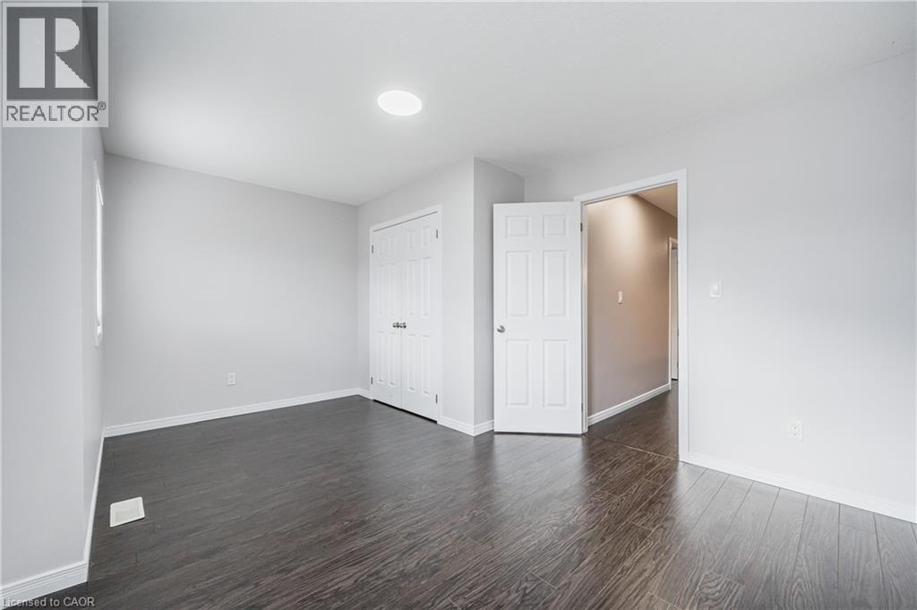Recessed ceiling lighting, wood-finish flooring, and white interior doors - 224 Jessica Crescent Unit# B, Kitchener, ON