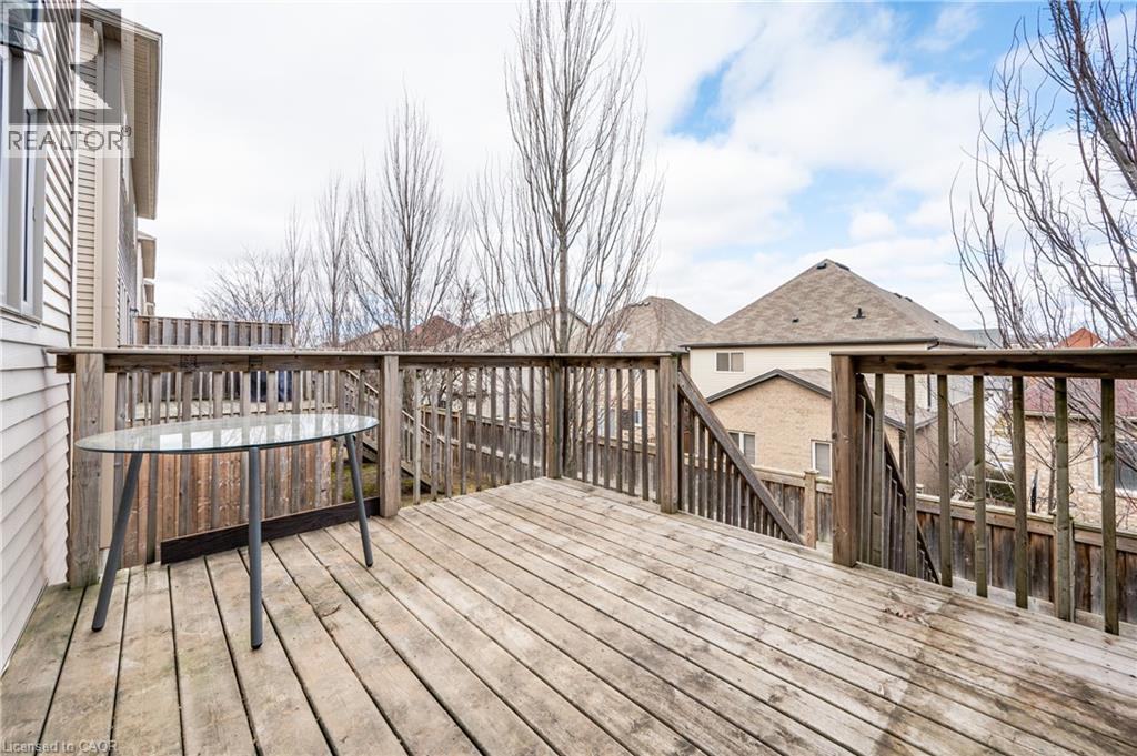 Expansive outdoor wood deck with natural wood railing and a set of exterior stairs - 224 Jessica Crescent Unit# B, Kitchener, ON
