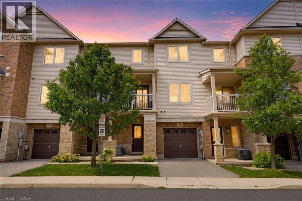 Multi-level townhome featuring a stone and siding facade - 541 Winston Road Unit# 50, Grimsby, ON