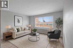 Virtually staged Living room featuring and laminate flooring and large window -
