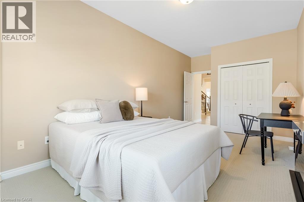 Carpeted flooring, vaulted ceiling, and bi-fold closet doors - 227 Chestnut Hill Crescent, Kitchener, ON