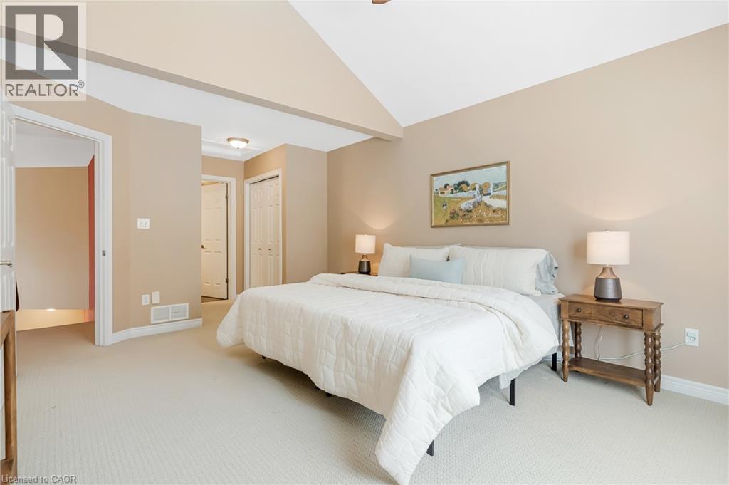 Vaulted ceiling, neutral wall tones, flush mount lighting, and carpet flooring - 227 Chestnut Hill Crescent, Kitchener, ON