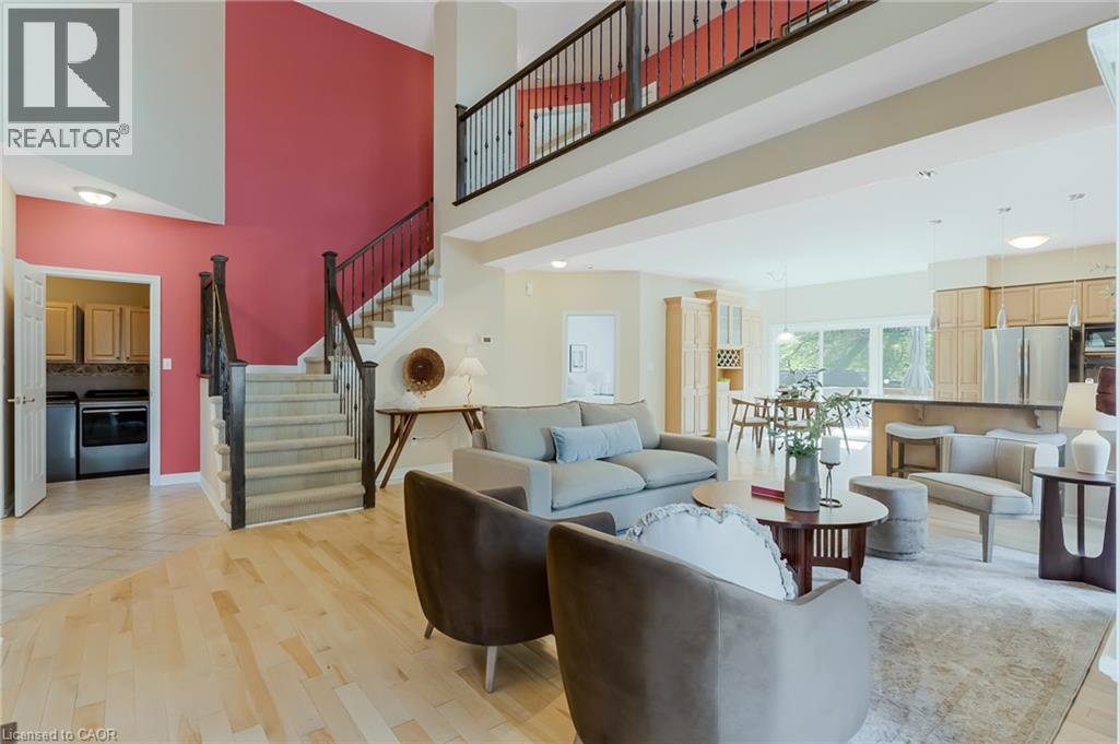 Two-story entry with an open-tread staircase and a second-level balcony - 227 Chestnut Hill Crescent, Kitchener, ON