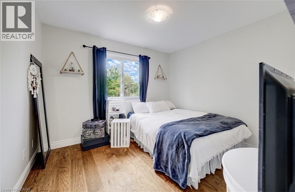 Hardwood flooring, recessed lighting, and a window with exterior views - 245 Fern Crescent, Waterloo, ON