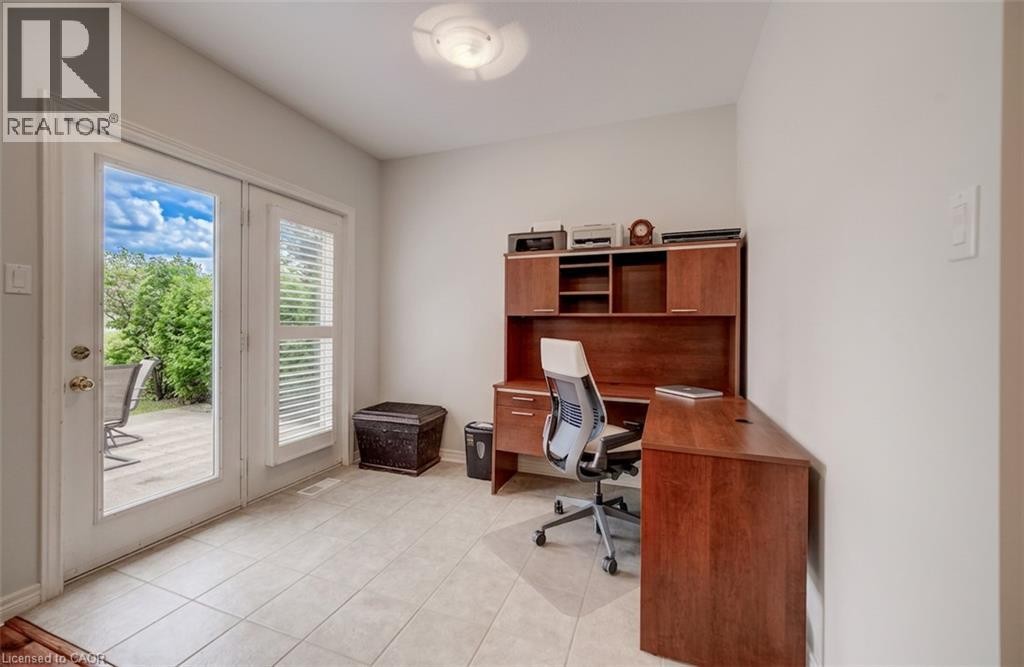 Neutral wall paint throughout, light-toned tile flooring, and permanent ceiling light fixture - 245 Fern Crescent, Waterloo, ON