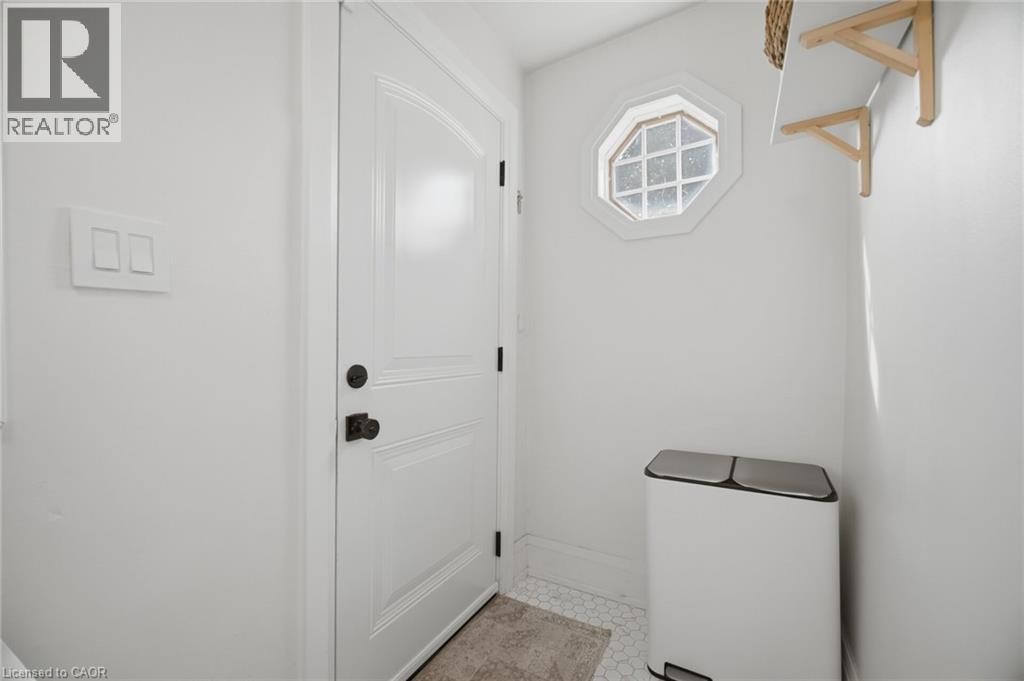 White paneled door with dark hardware - 146 Campbell Avenue, Hamilton, ON