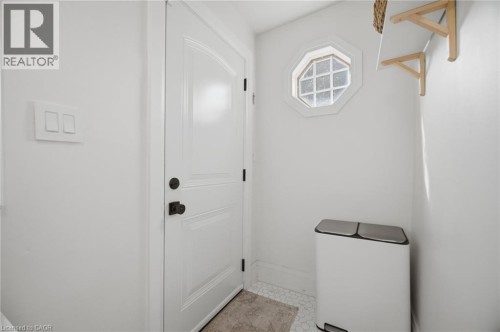 White paneled door with dark hardware - 146 Campbell Avenue, Hamilton, ON 