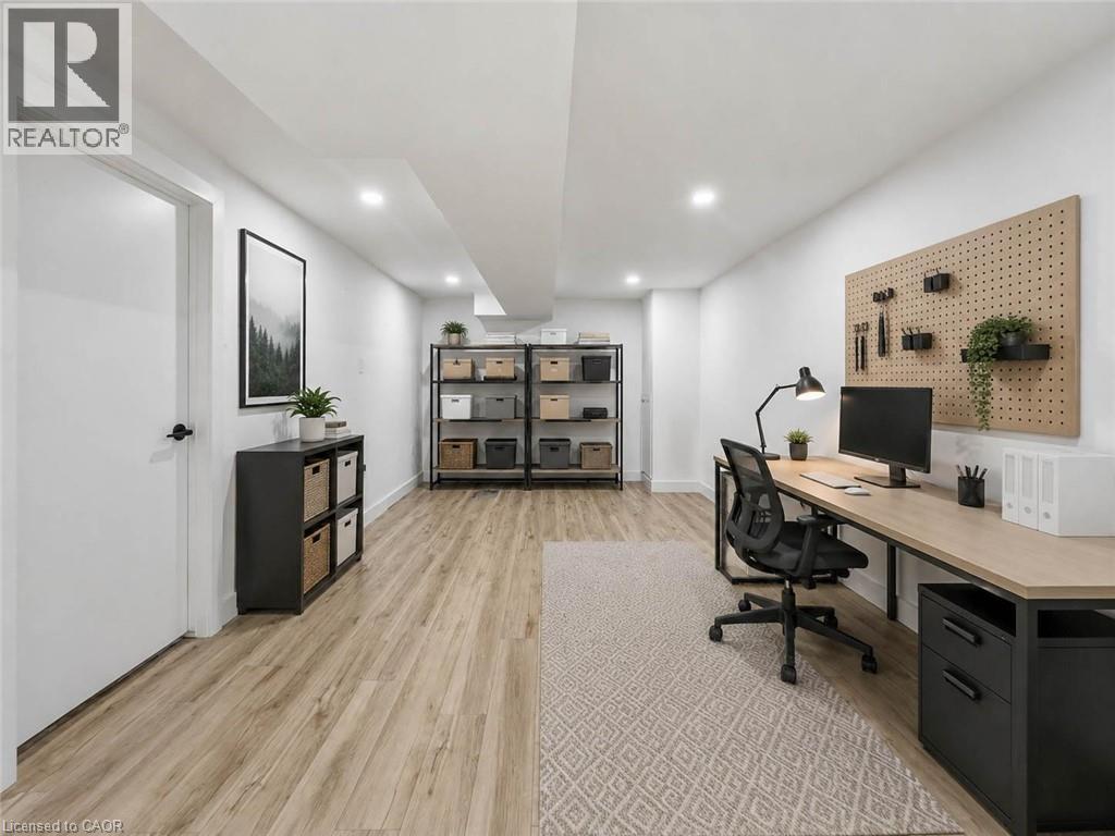 Recessed lighting illuminates wood-finish flooring - 220 Cairn Street, London, ON
