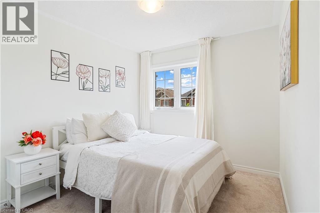 Carpeted flooring, white walls, crown molding, double-pane window, flush mount lighting - 68 Barkerville Drive, Whitby, ON