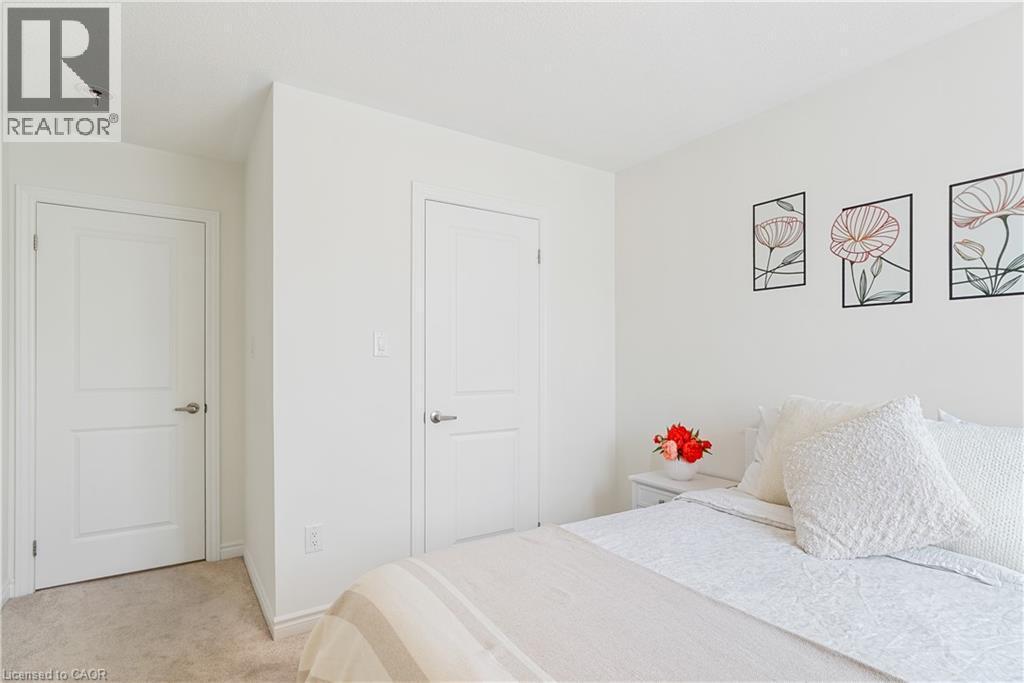Wall-to-wall carpeting and white interior doors with satin nickel hardware - 68 Barkerville Drive, Whitby, ON