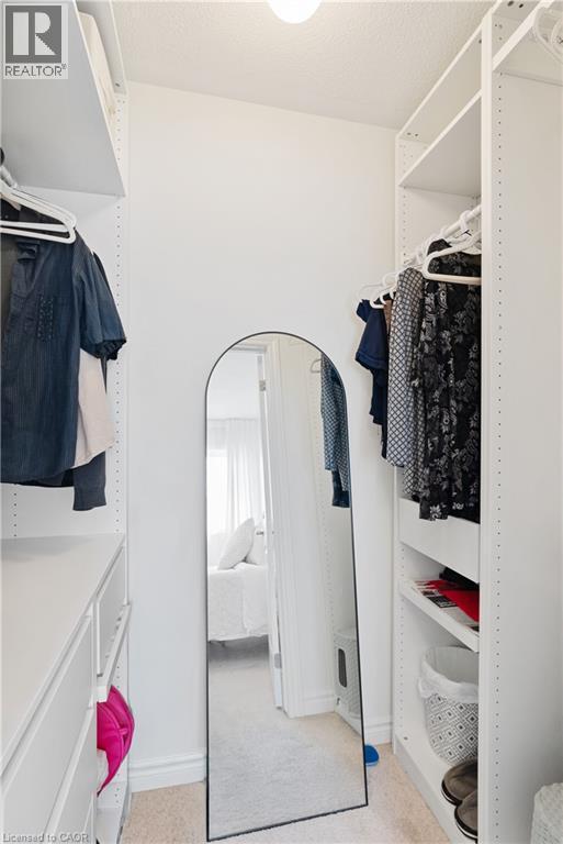 Built-in shelving units, integrated clothing rods, and drawer storage - 68 Barkerville Drive, Whitby, ON