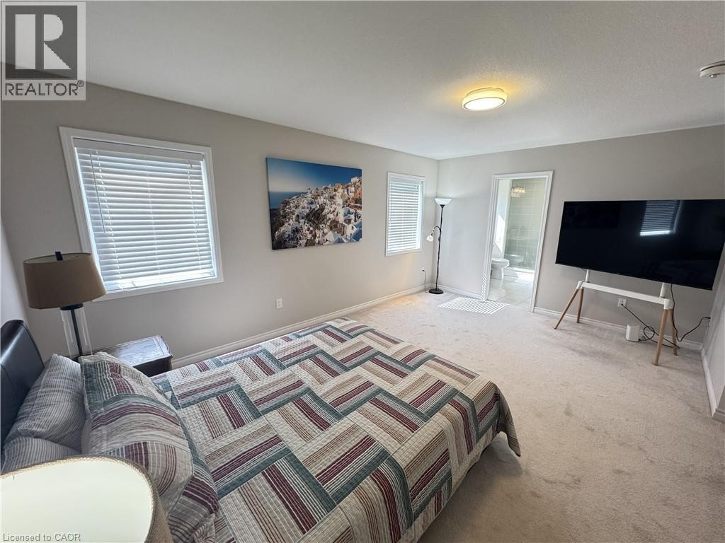 Recessed lighting, light-colored carpeting, multiple windows with blinds, and an attached three-piece bathroom - 67 Pointer Street, Cambridge, ON
