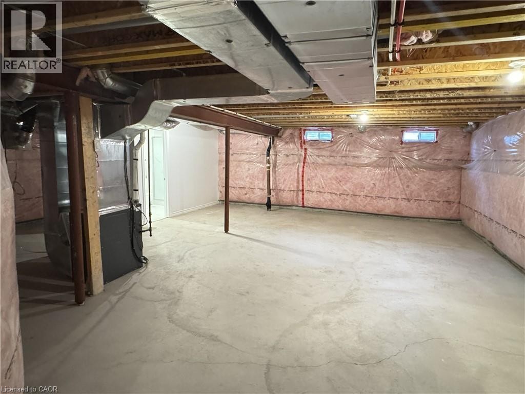 Unfinished lower level with concrete flooring, exposed ceiling joists, and insulated walls - 67 Pointer Street, Cambridge, ON