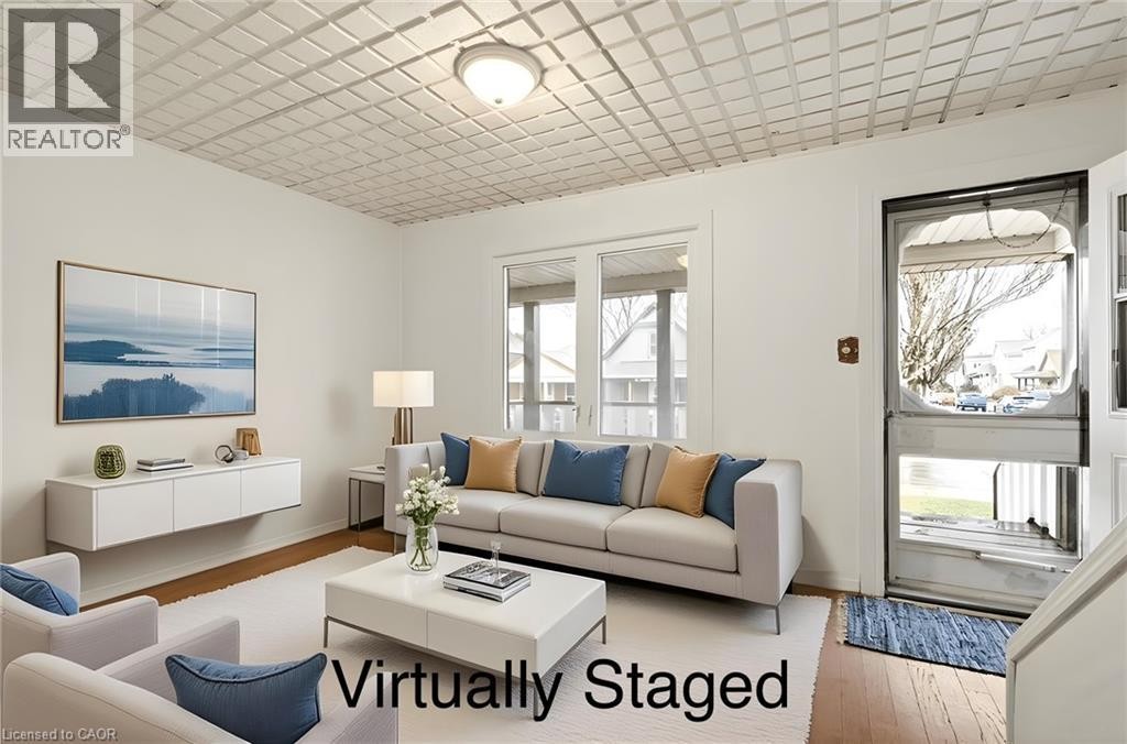 Hardwood-style flooring, white walls, and a decorative ceiling - 23 Frederick Avenue, Hamilton, ON