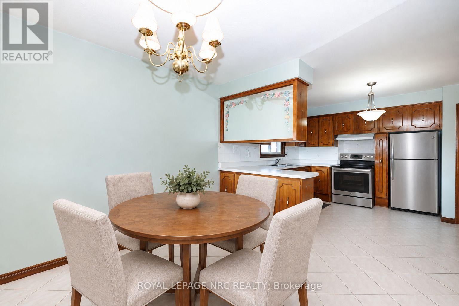 Virtually staged kitchen and dining room - 38 Rivercrest Road, Hamilton (Riverdale), ON