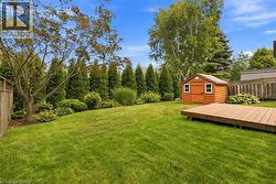 Virtually enhanced to demonstrate potential backyard privacy with cedar trees -