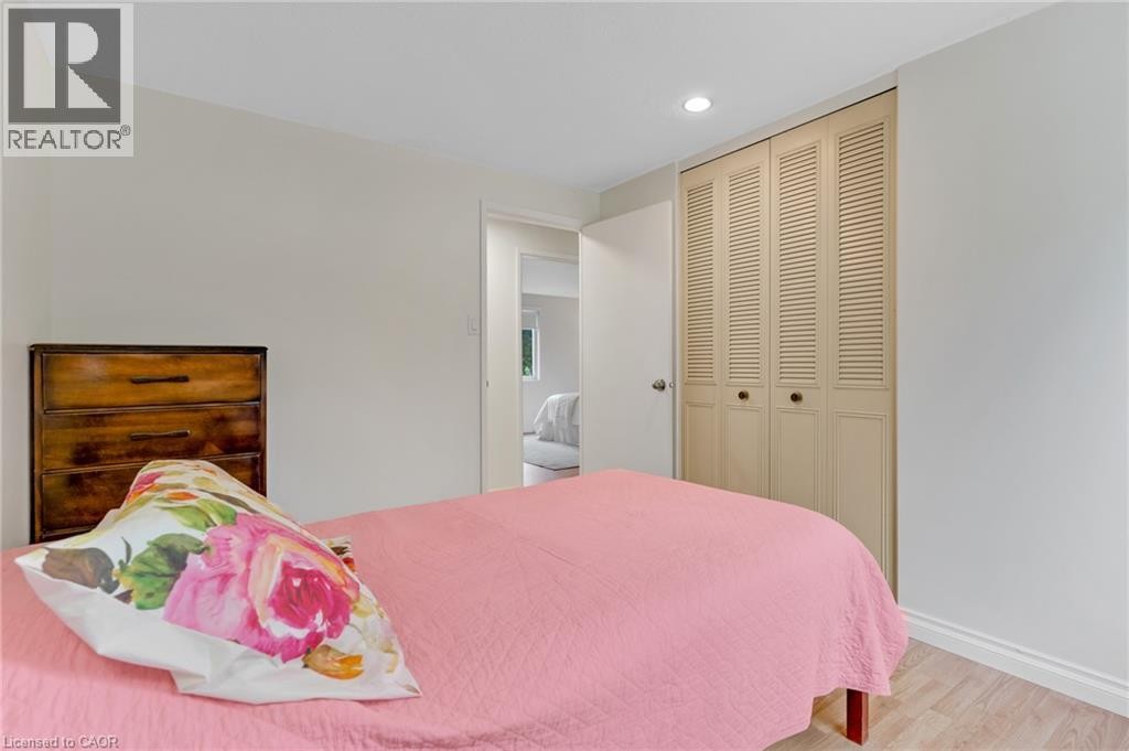 Recessed ceiling light, louvered bi-fold closet doors, light wood-finish flooring, white trim - 7 Underhill Crescent, Kitchener, ON