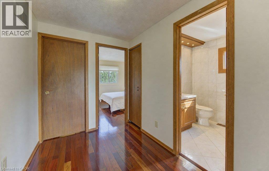Hardwood-finish flooring throughout the hallway - 238 Mcgarry Drive, Kitchener, ON