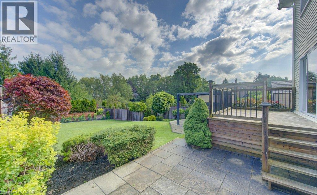 Great backyard for entertaining with two patios and a deck - 238 Mcgarry Drive, Kitchener, ON