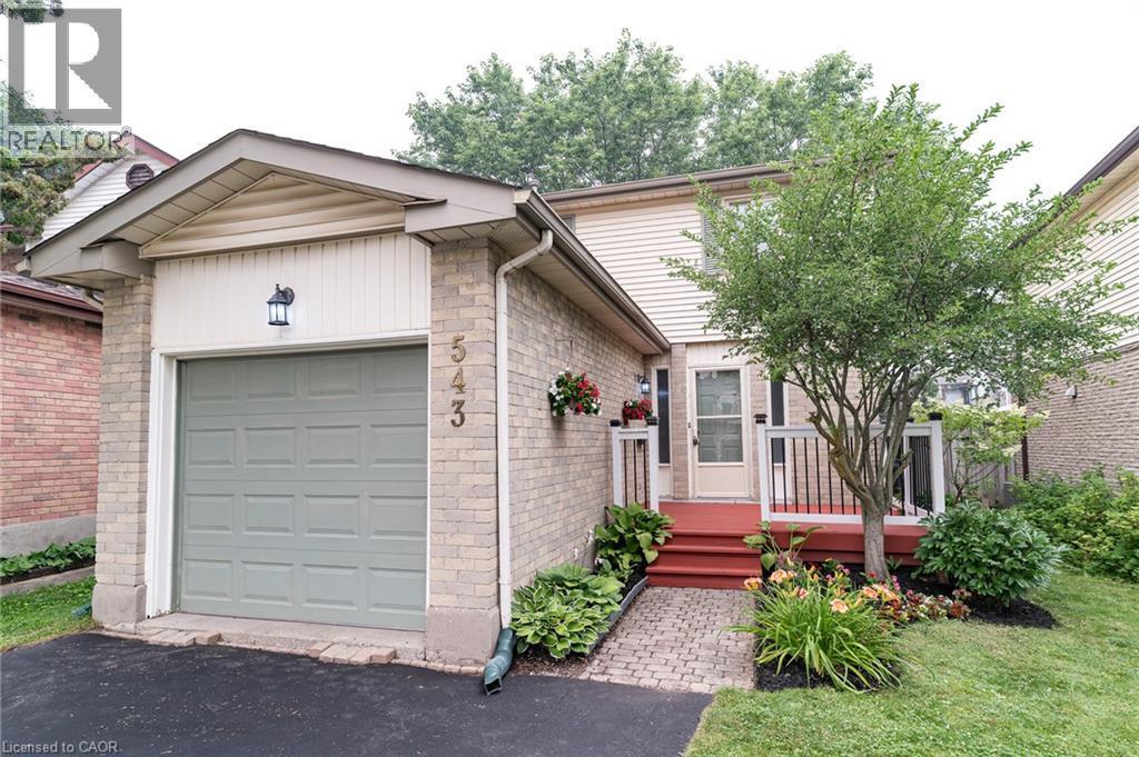 Brick facade with light grey siding - 543 Drummerhill Crescent, Waterloo, ON